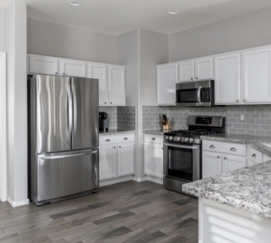 a large kitchen with stainless steel appliances