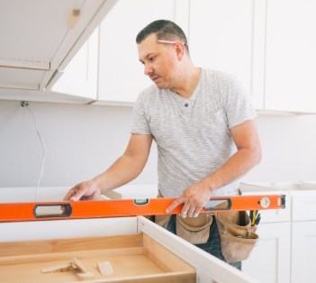 a man cooking in a kitchen preparing food