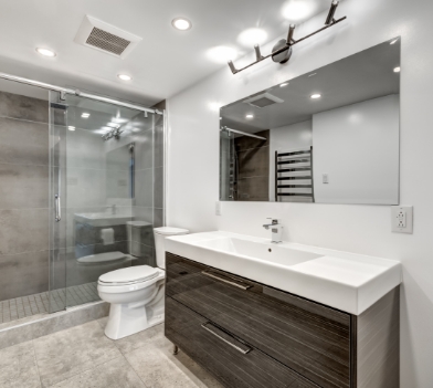 a room with a sink and a mirror